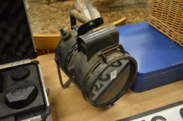 A hand held Tilley lamp.