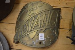A cast bronze plaque 'Advance'.