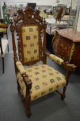 A good large carved oak throne style armchair.