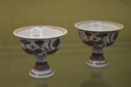 A pair of small Chinese stem cups.