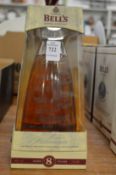 A Bells millennium whisky decanter, boxed.