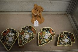 A Turkish pottery figure of a musician together with four Armenian dishes.