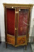 A decorative mahogany ormolu and painted two door standing vitrine cabinet (lacking one glazed