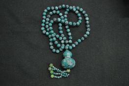 A turquoise bead necklace.