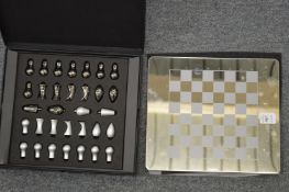 An Aquascutum travelling chess set.
