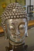 Silver decorated Buddha's head.