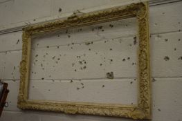 A decorative white painted and parcel gilded mirror or picture frame.
