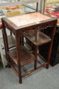 A Chinese hardwood stand with marble inset top.