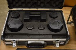 Aluminium case containing a set of calibrated imperial weights.