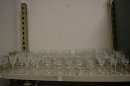 A quantity of matching Thomas Webb cut glass drinking glasses and similar whisky tumblers.