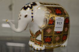 A Royal Crown Derby model of an elephant.