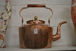 A large copper kettle.