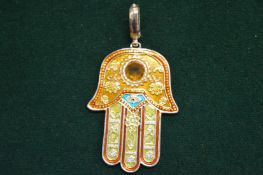 A decorative Islamic pendant.