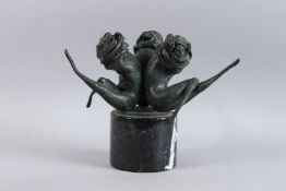 AN ABSTRACT BRONZE GROUP OF THREE DANCERS. 7ins high on a circular marble base. 11ins high overall.