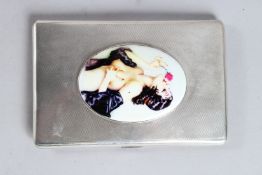 A GEORGE VI ENGINE TURNED SILVER CIGARETTE CASE. 5ins x 3.5ins. Birmingham 1937, with an oval enamel