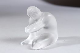 A LALIQUE GLASS KNEELING NUDE WOMAN, etched Lalique, France. 2.5ins high, boxed.
