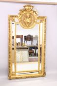 A LARGE LOUIS XVITH STYLE GILTWOOD MIRROR. 7ft high x 3ft 4ins wide.