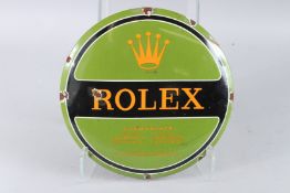 A ROLEX GREEN CIRCULAR ENAMEL SIGN. 11.5ins diameter.