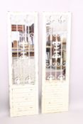 A PAIR OF PAINTED GARDEN MIRRORS.