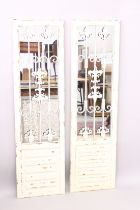 A PAIR OF PAINTED GARDEN MIRRORS.