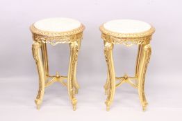 A PAIR F LOUIS XVITH STYLE CIRCULAR MARBLE TOP TABLES with cross-framed stretcher. 1ft 5ins diameter