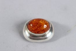 A SILVER EMBER PENDANT.