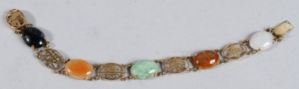 A 14CT GOLD CHINESE JADE BRACELET.