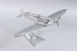 A CHROME SPITFIRE ORNAMENT. 11ins long.