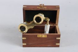 A PAIR OF MOTHER-OF-PEARL OPERA GLASSES in a wooden box.