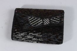 A KAI-YIN LO BEAD EVENING BAG.
