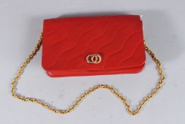 A RED ED REILLY, PARIS LEATHER BAG.