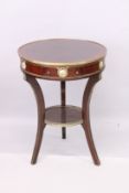 A LOUIS XVITH STYLE CIRCULAR TABLE with frieze drawer, porcelain panels, on curving legs with