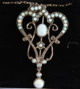 A 9CT GOLD OPAL PENDANT ON A 9CT GOLD CHAIN.