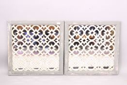 A PAIR OF PAINTED GARDEN MIRRORS.