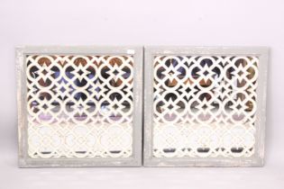 A PAIR OF PAINTED GARDEN MIRRORS.