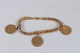 A PAIR OF GILT COIN EARRINGS.