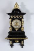 A VICTORIAN BLACK EBONISED BRACKET CLOCK AND BRACKET with gilt metal swags, columns etc. 17ins