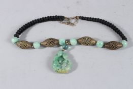 AN ISLAMIC JADE NECKLACE AND PENDANT.
