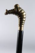 A MICHELIN HANDLE WALKING STICK. 36ins long.
