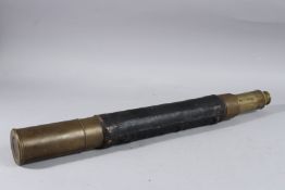 A VICTORIAN BRASS BANDED LEATHER TELESCOPE. 23ins long x 2.25ins diameter.