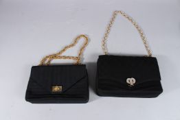 TWO BLACK BAGS with gilt strap.