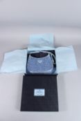 A PRADA BLUE DIAMANTE EVENING BAG, in original box with papers. 8.5ins wide.