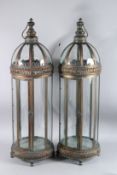 A LARGE PAIR OF CIRCULAR COPPER LANTERNS. 36ins high.