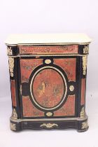 A GOOD BOULLE PIER CABINET with marble top, single drawer over a panel door with large oval. 3ft