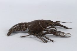 A LARGE JAPANESE BRONZE ARTICULATED LOBSTER. 10.5ins long.