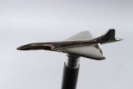A CONCORDE HANDLE WALKING STICK. 36ins long.