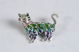 A SILVER AND RUBY COLLAR AND EYE PLIQUE ENAMEL CAT BROOCH.