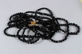 A TEN ROW JET NECKLACE with a diamante clasp.
