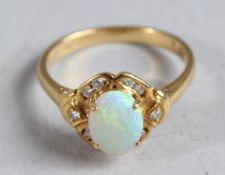 AN OPAL AND DIAMOND RING with an 18ct gold setting.