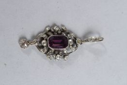 AN AMETHYST AND DIAMOND PENDANT.